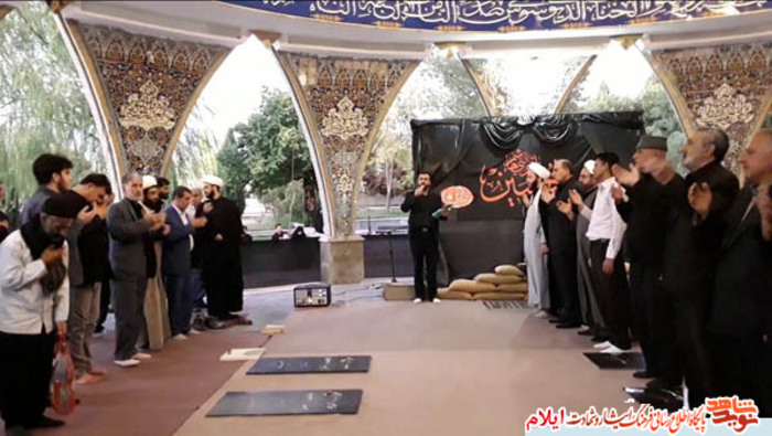 مراسم معنوی زیارت عاشورا در گلزار شهدای بهشت رضا شهرایلام